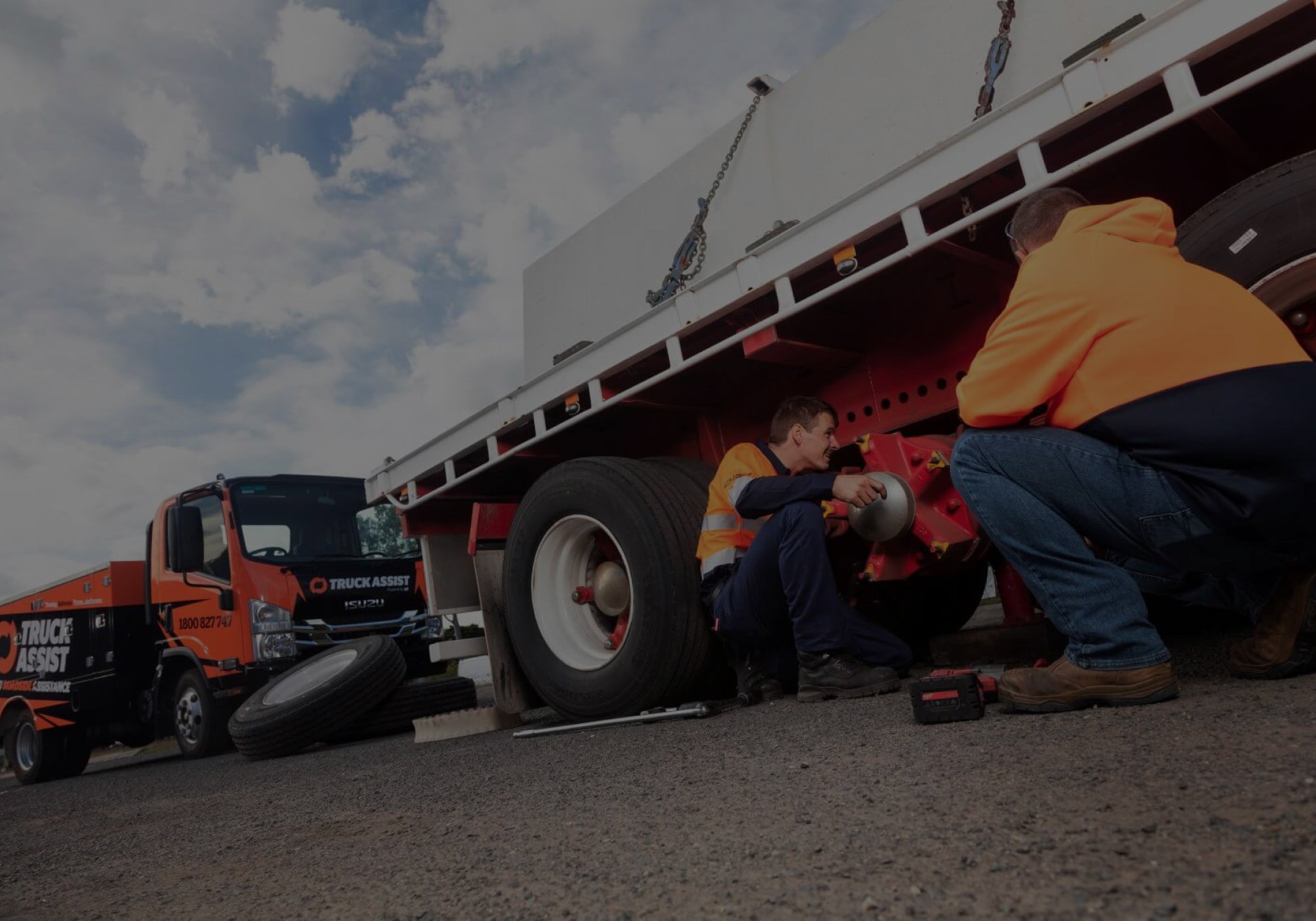 A Truck Assist employee changing a truck tyre 